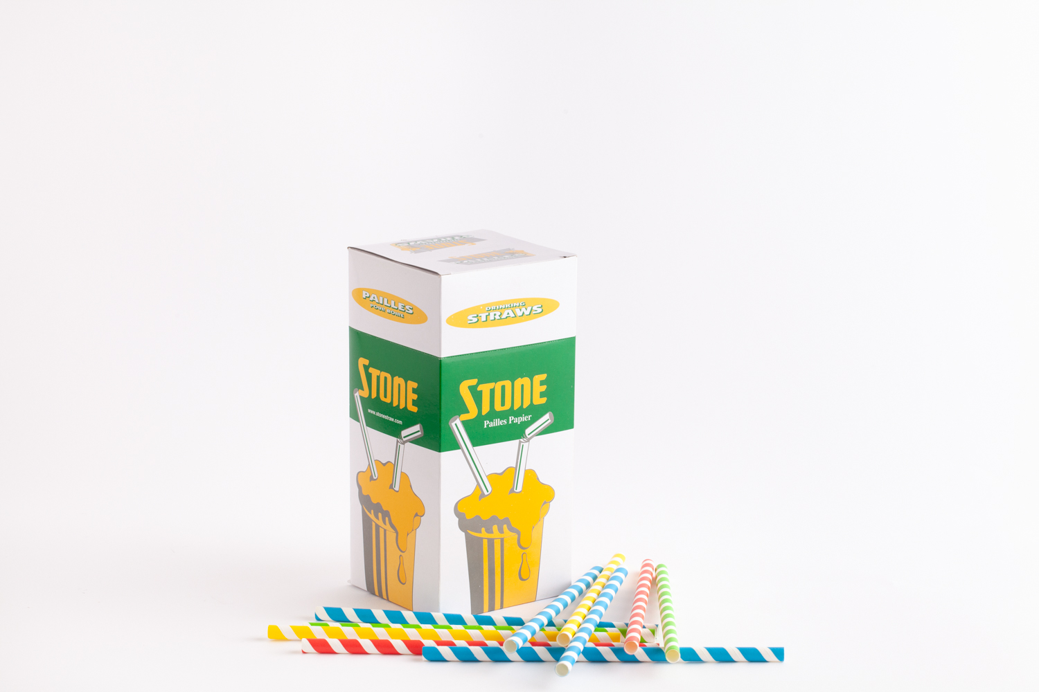 stone straw package standing upright with a variety of different coloured paper straw laying to the right of the package