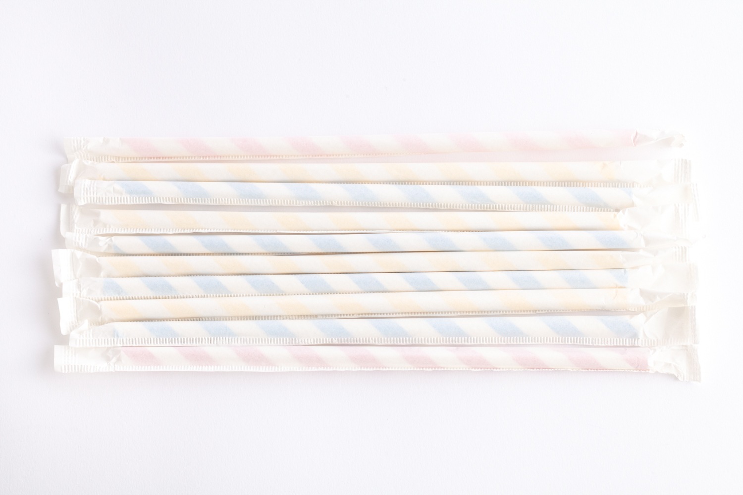 multi-coloured paper straws lined up side by side
