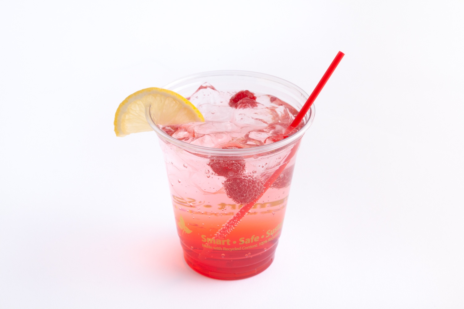 closeup of drink in clear drinking cup with red cocktail straw