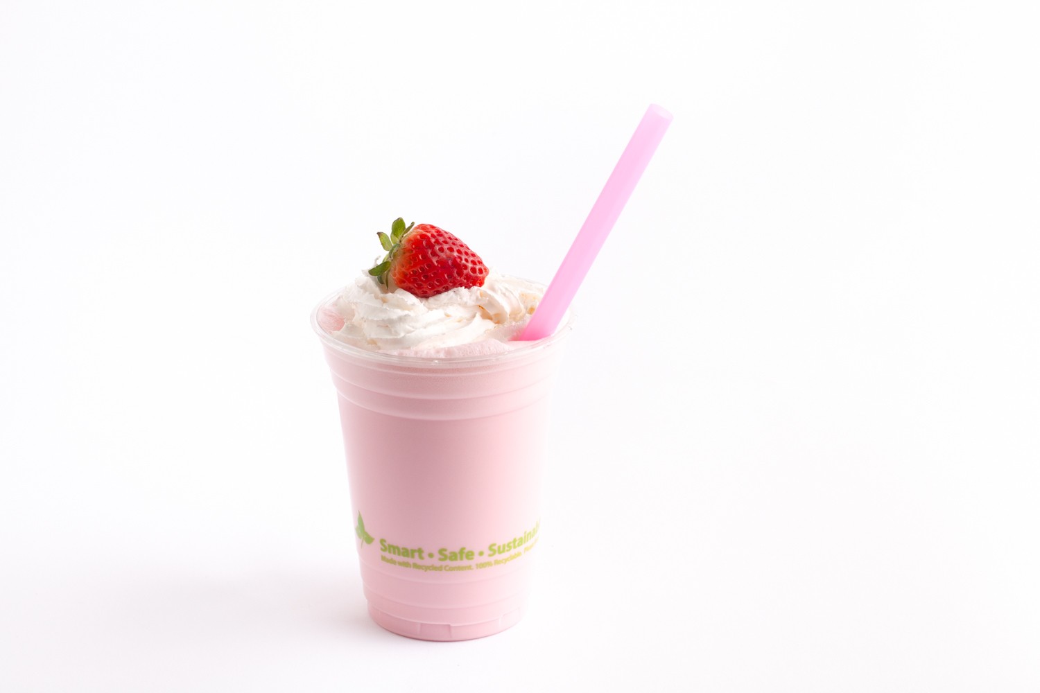 strawberry milkshake in clear drinking cup with big pink straw