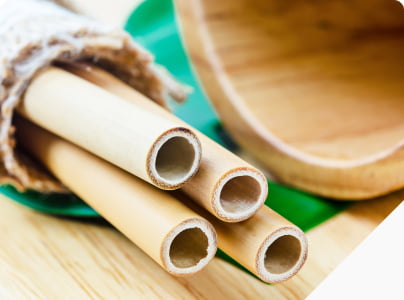 re-usable or compostable bamboo straws laying on table