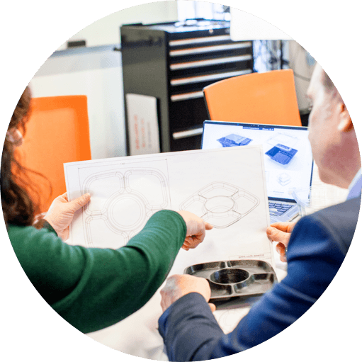 employees compare product CAD drawing and physical product