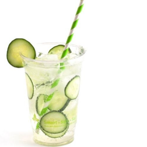 isolated drink cup with cucumber water and straw