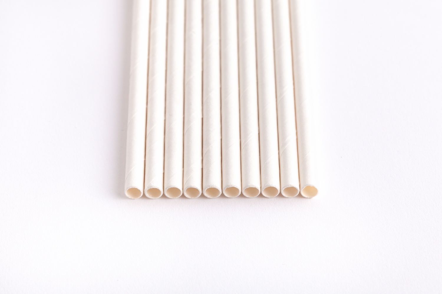 white paper straws lined up side by side