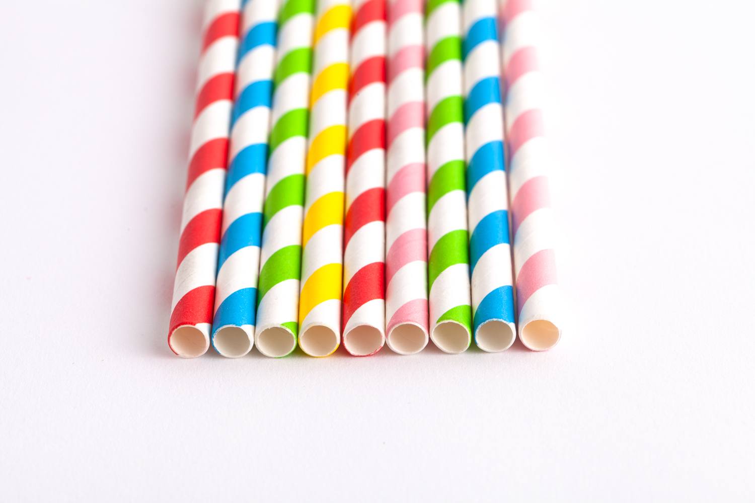 multi-coloured paper straws lined up side by side