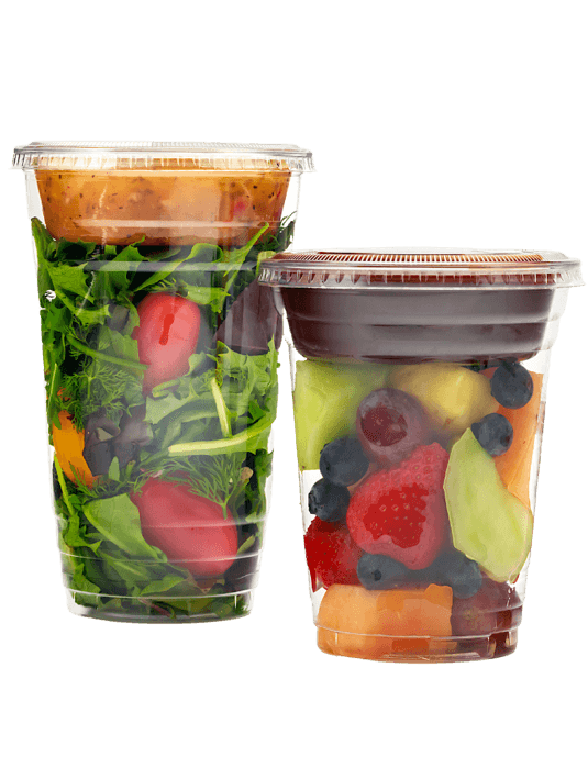 2 isolated clear cups 1 with salad + dressing, 1 with fruit + dipping sauce