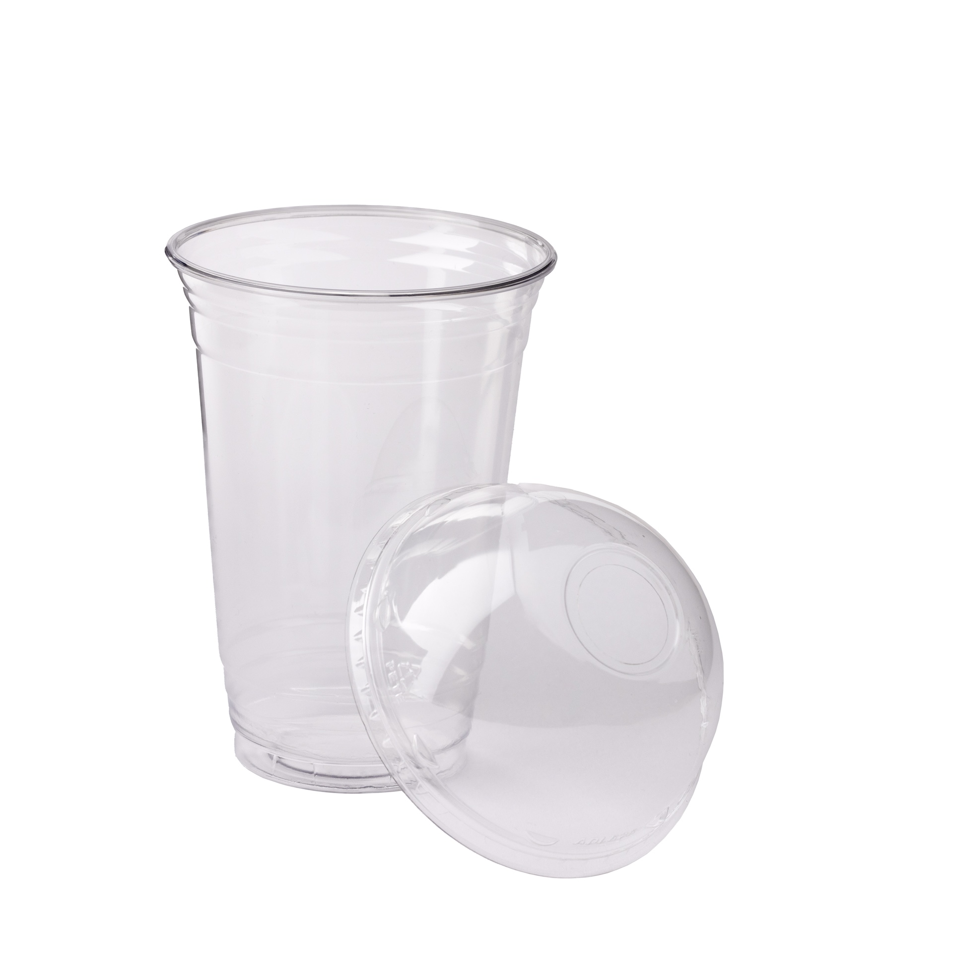 Transparent plastic cup with a clear dome lid resting beside it.